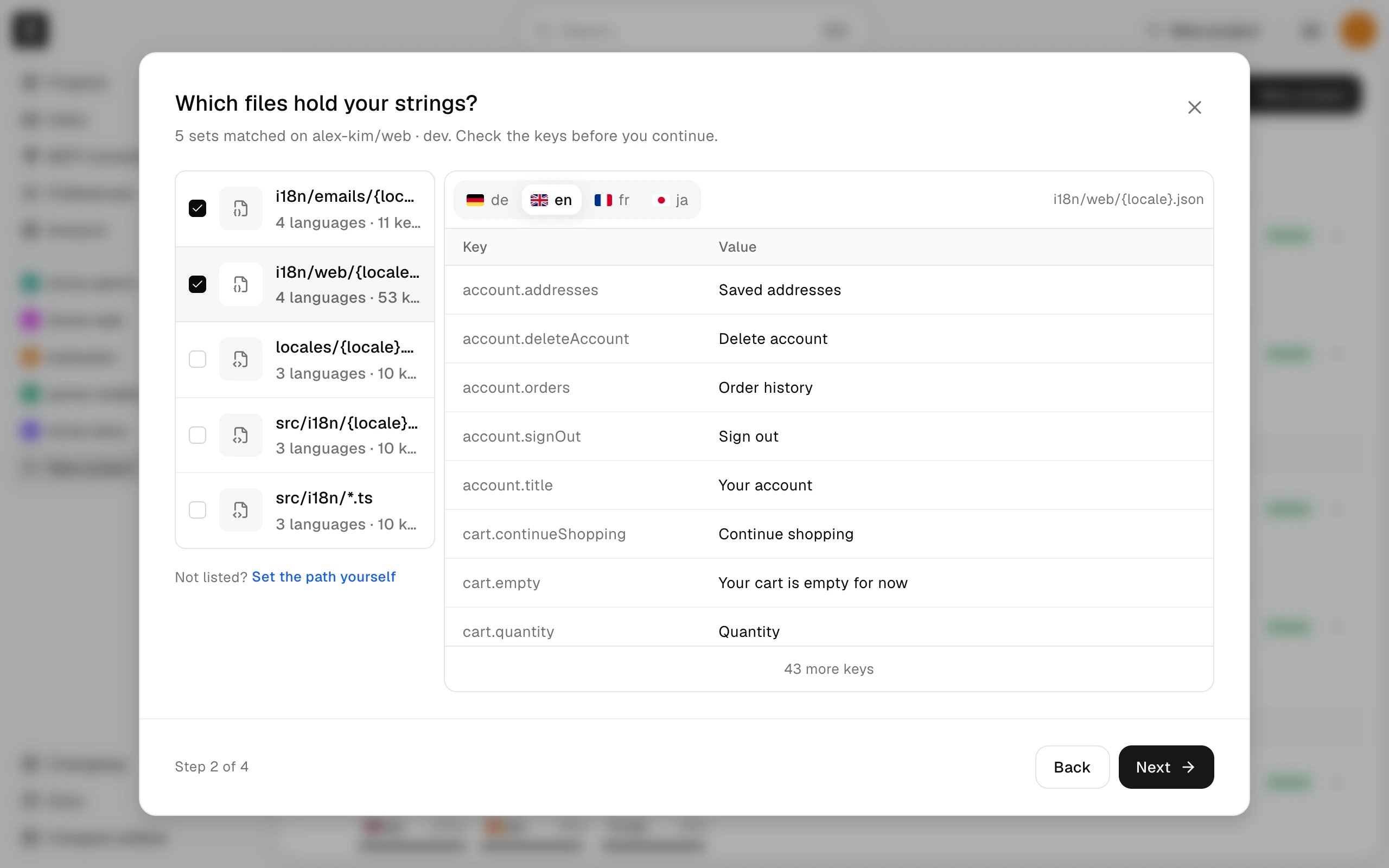Step 2 of 4 with two detected sets of translation files selected and a preview of one set's keys and values