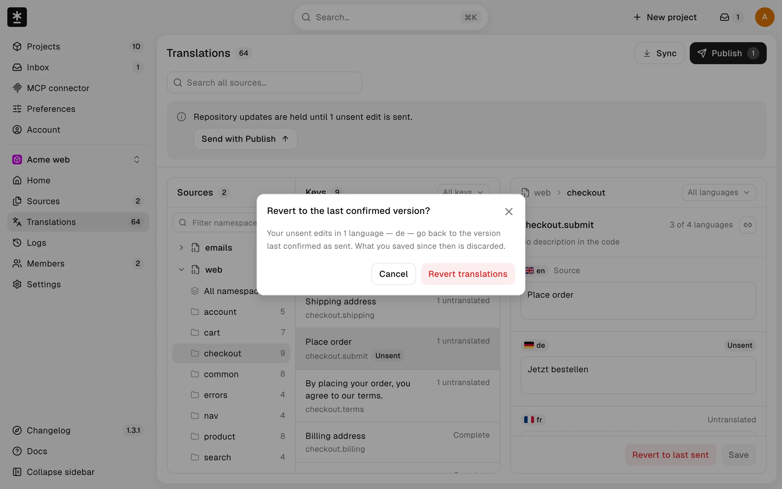 The Revert confirmation naming the one language that goes back to its last confirmed version, with Cancel and Revert translations buttons